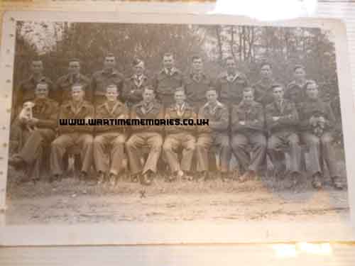 POWs, Frank is seated 4th from left