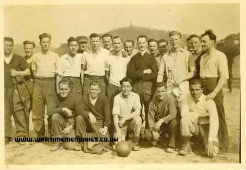 This picture may have been taken in the camp but has nothing positively identifying it. My father is 4th from the right standing with the fair hair. I do not know who any of the others are.