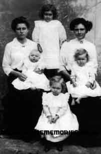 Arthur's widow, Alice (seated right) and his brother Ernest's widow, Isabella, with their children.