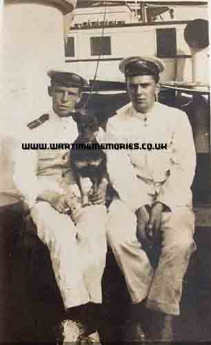 Taken at sea. Edwin Heman Price holding dog. 