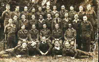 Ken is pictured 4th from the right standing middle row. He has open tunic with jumper exposed.