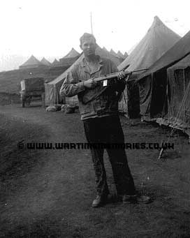 Paul Smith with an M-1 carbine, I don't know the exact location.
